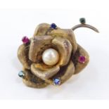 A mid century silver cultured pearl and paste set floral brooch.