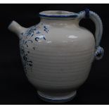 An Italian 19thC pottery blue and white apothecary's jug, decorated with flowers and reserve banner,