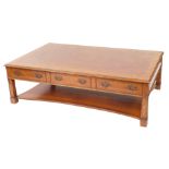 A burr walnut mahogany and herringbone banded coffee table, the rectangular top over three frieze dr