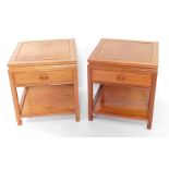 A pair of Chinese pale teak bedside tables, with a single frieze drawer, raised on tapering square l