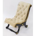 A Victorian ebonised child's X frame chair, with a scroll back, with buttoned floral over stuffed up
