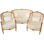 A French Louis XVI style beech wood two seater canape, with a carved show frame, pale gold fabric, f