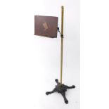 A Victorian brass cast iron and wooden reading stand, by White and Wright of Liverpool, 118cm high.