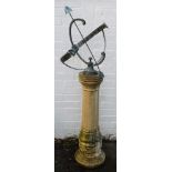 A brass armillary sundial, raised on a concrete column base, 140cm high.