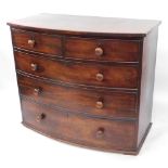 A Georgian mahogany bow front chest, of two short over three long drawers, feet lacking, 100cm high,