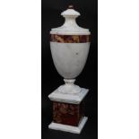 A white and red veined marble garniture urn, of baluster form, raised on an integral plinth base, 38