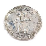 A novelty dish, with hammered detailing of two children holding a dove, with floral border, maker's