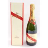 A bottle of GH Mumm champagne, boxed.