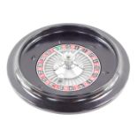 A late 20thC bakelite roulette wheel, 5.5cm diamter.
