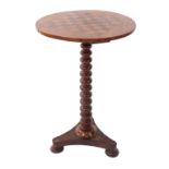 A Victorian specimen wood games table, the circular top inlaid with a rosewood and satin wood chess
