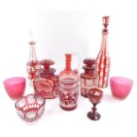 A group of 19thC and later cranberry and ruby glassware, to include a flashed glass decanter and sto