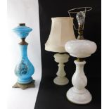 A Victorian pressed milk glass oil lamp, converted to electricity, moulded with vines, 59cm high, an