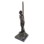 A bronze figure of Andromeda, modeled standing chained to a post, raised on a black marble base, 49c