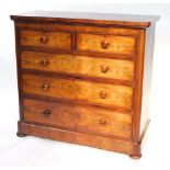 A Victorian flame mahogany chest, of two short over three long drawers, raised on a plinth base abov