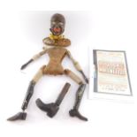 A Victorian marionette of a black gentleman, carved in wood, the torso marked in ink "K Barnard, Bul