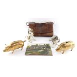 Brass piggy banks, a Royal Belvedere porcelain figure of spaniel, and a Keramos figure of a spaniel,