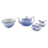 A Spode pottery blue and white teapot decorated in the Italian pattern, together with a cream jug an