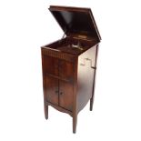 A Lavette oak cased cabinet gramophone, the levered top gramophone section over a two door enclosed