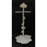 A Victorian cast iron umbrella stand, of leaf and vine form, later painted white, 60cm high.