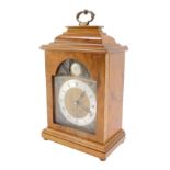 An Elliott mid century walnut cased mantel clock, break arch tempus fugit dial, with chapter ring be
