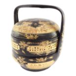 A Chinese black and gilt lacquer tiffin box, of cylindrical form, decorated with birds and blossom,