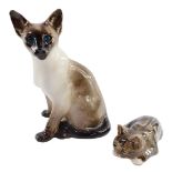 A Winstanley pottery figure of a Siamese cat, modeled seated, with blue glass eyes, 31cm high (AF),