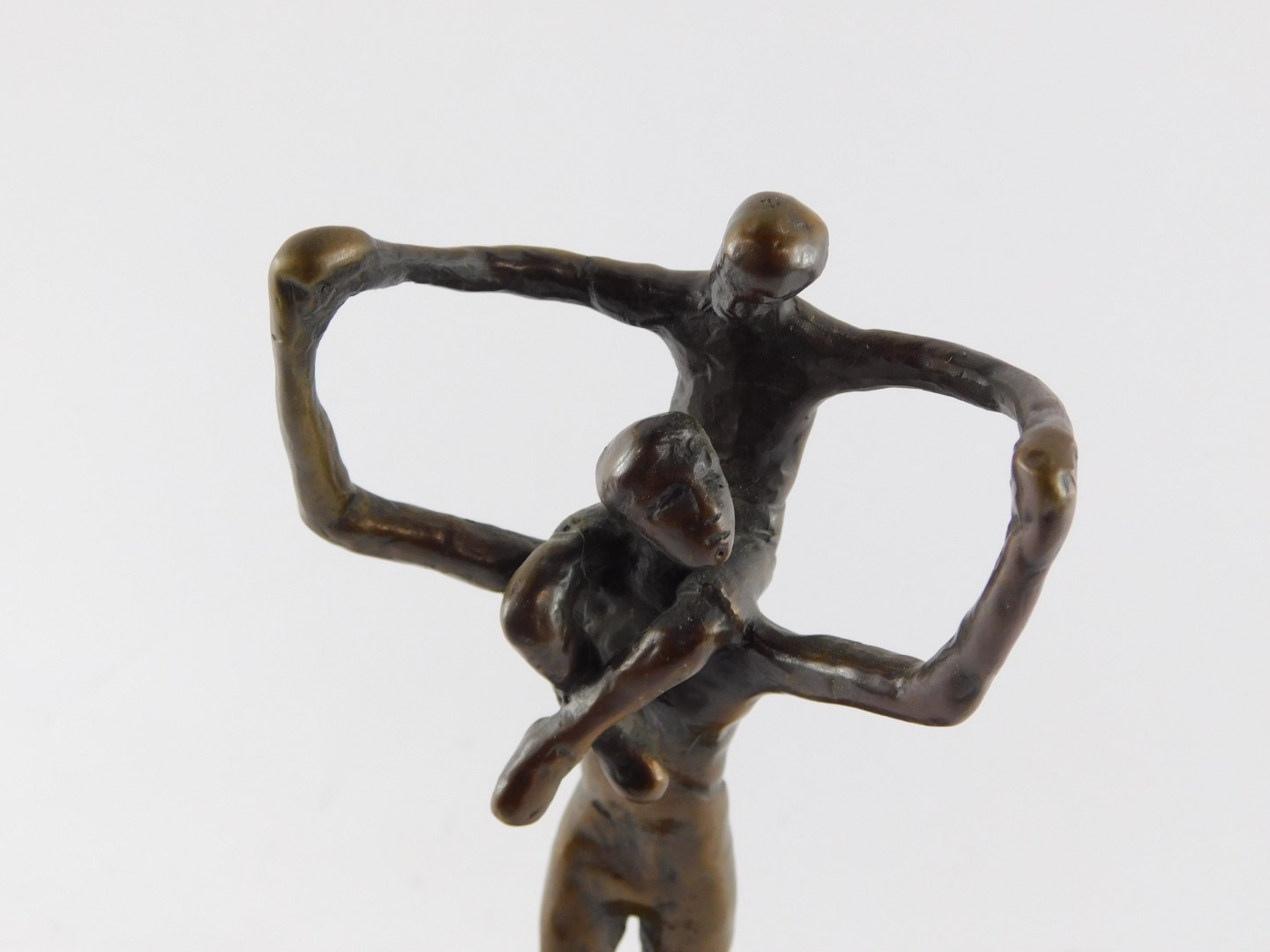 A bronze figure of a father modelled standing with a child on his shoulders, bears signature, raised - Bild 3 aus 5