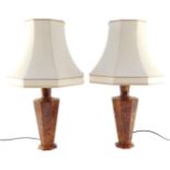 A pair of burr walnut table lamps, of octagonal form, with shades, 64cm high.