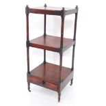A Victorian mahogany three tier whatnot, raised on turned supports, with a frieze drawer below, on t