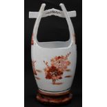 A Japanese porcelain bucket, possibly Arita, decorated in iron red and gold with floral sprays, char