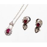 An 18ct white gold ruby and diamond jewellery suite, comprising earrings and necklace, each with bru