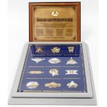 A group of Star Trek Memorabilia, to include a USS Enterprise sign, and a cased twelve badge set, to