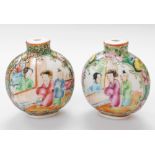 A pair of Canton snuff bottles, each decorated with figures, birds and flowers, 6cm high. (AF)