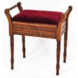 An Edwardian walnut piano stool, with red velvet cushion top and ribboned detailed on lift up hinged