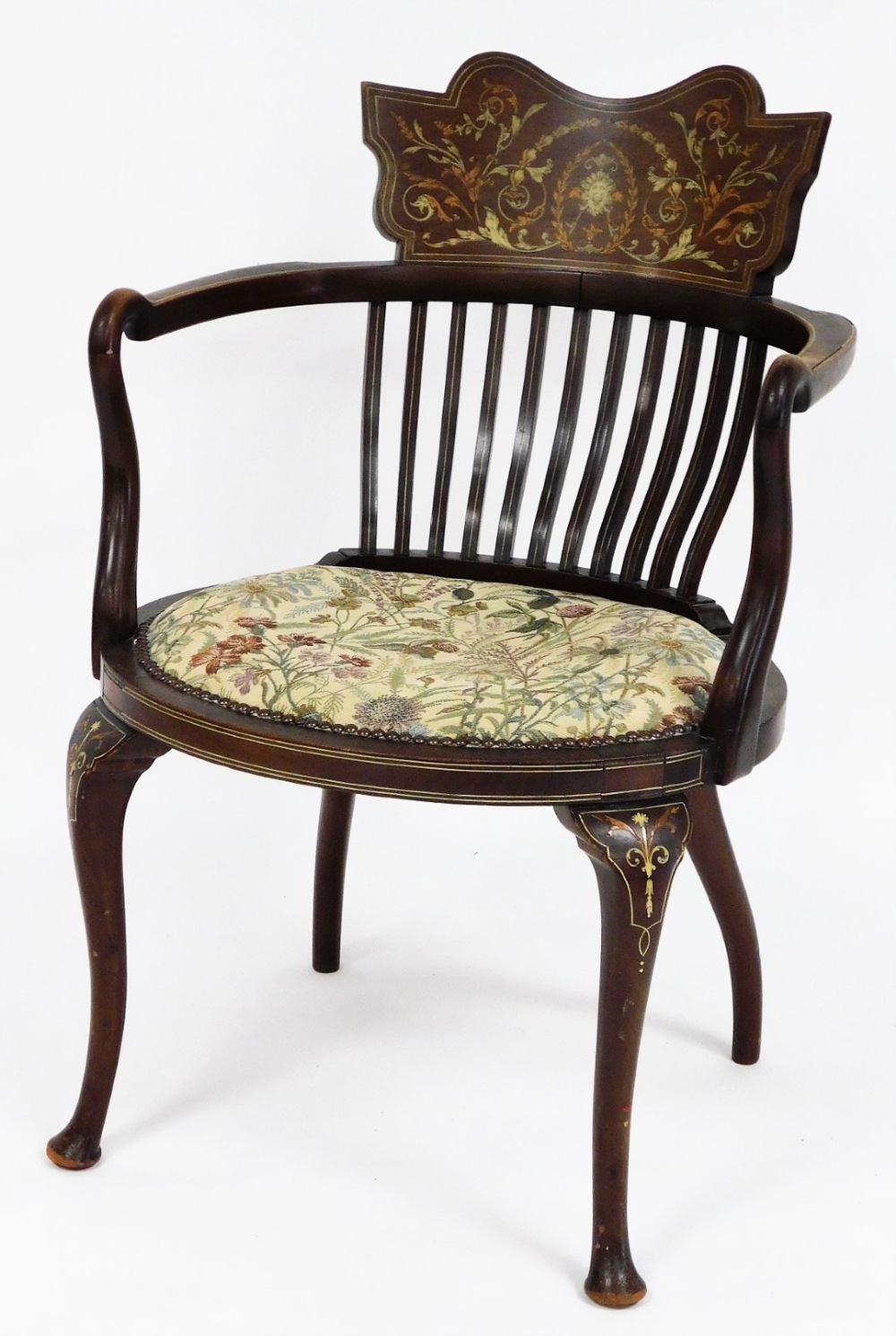 An Edwardian inlaid elbow chair, with slated back and carved shield crest with parquetry detailing o
