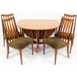 A G-Plan teak drop leaf dining table and four associated dining chairs, the table 73cm high, 106cm w