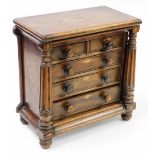 A Victorian apprentice chest of drawers, with two short and three long drawers, with columned suppor