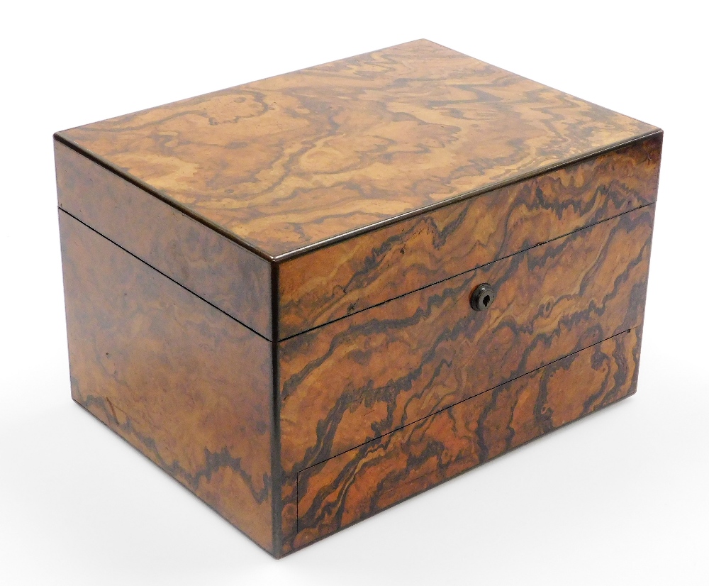 A late 19thC figured walnut writing box, the outer exterior with flamed detailing, and single drawer