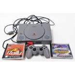 A Sony Playstation One console, and two games, Tony Hawks Skateboarding, and Rally Championship, tog