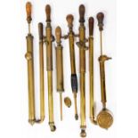 A group of brass garden syringes, etc. (a quantity)