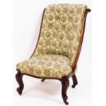 A Victorian mahogany nursing chair, with an upholstered button back and seat on carved legs, with ca
