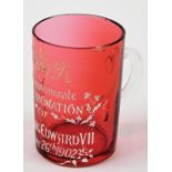A Edward VII cranberry glass commemorative tankard, with white applied detailing to commemorate the