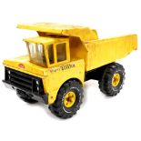 A Mighty Tonka Dumper Truck, in yellow, model no.XMB975, 26cm high, 45cm wide.