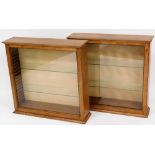 Two light wood display cabinets, each with cornice top and various glass shelves, 75cm high, 78cm wi