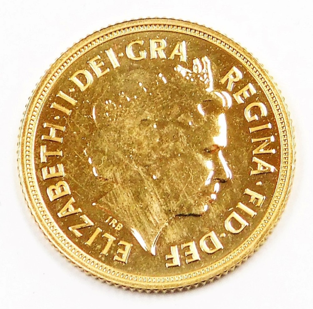 An Elizabeth II full gold sovereign, dated 2014, in plastic coin casing. - Image 2 of 2