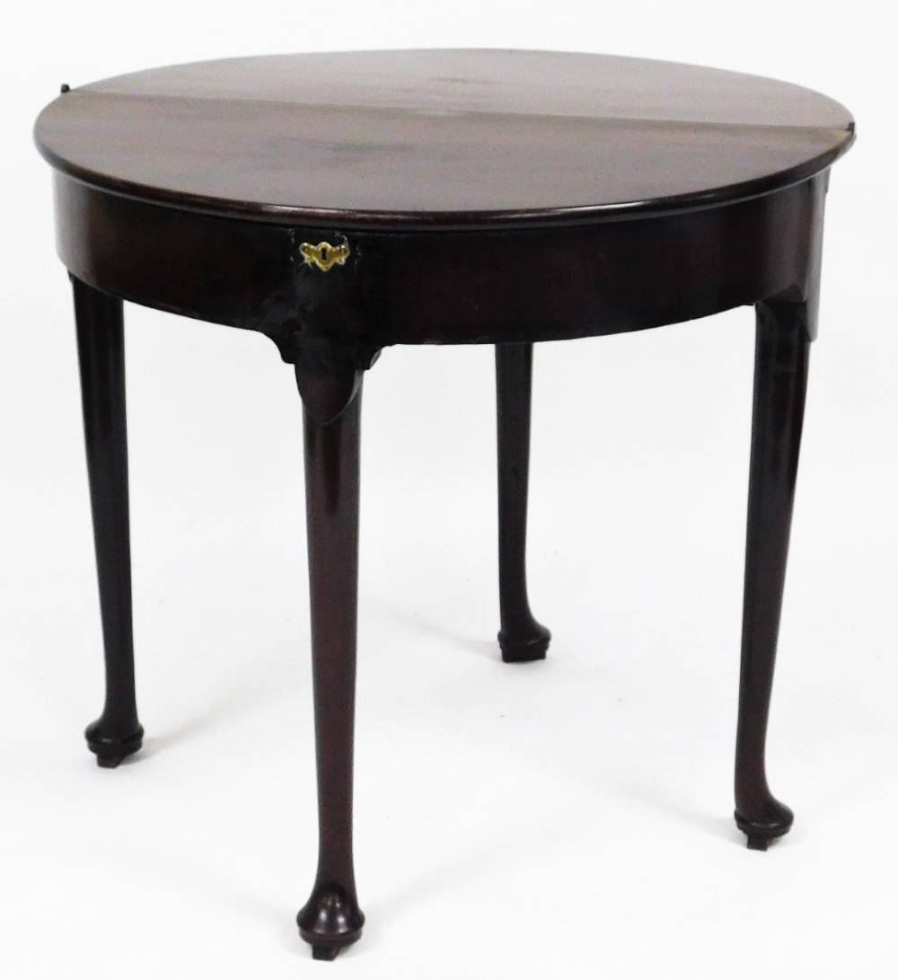 An 18thC mahogany demi lune tea table, with fold over top on pad feet with brass escutcheon, 75cm hi - Image 2 of 2