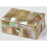 A mother of pearl inlaid trinket box, rectangular with three sectional top and a cream lined interio