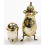 Two silver pepper pots, to include George V example London assay, and a large fluted design example