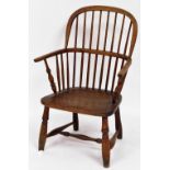 An early 19thC ash and elm Windsor chair, with spindle back and solid seat, 93cm high, 55cm wide, 40