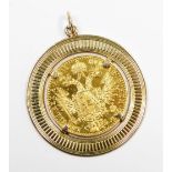 A French coin pendant, with coin dated 1915, in a 9ct gold pendant mount, 5.8g all in.
